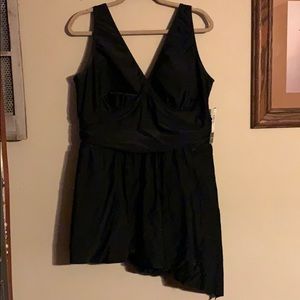 Black swim suit with asymmetrical skirt.